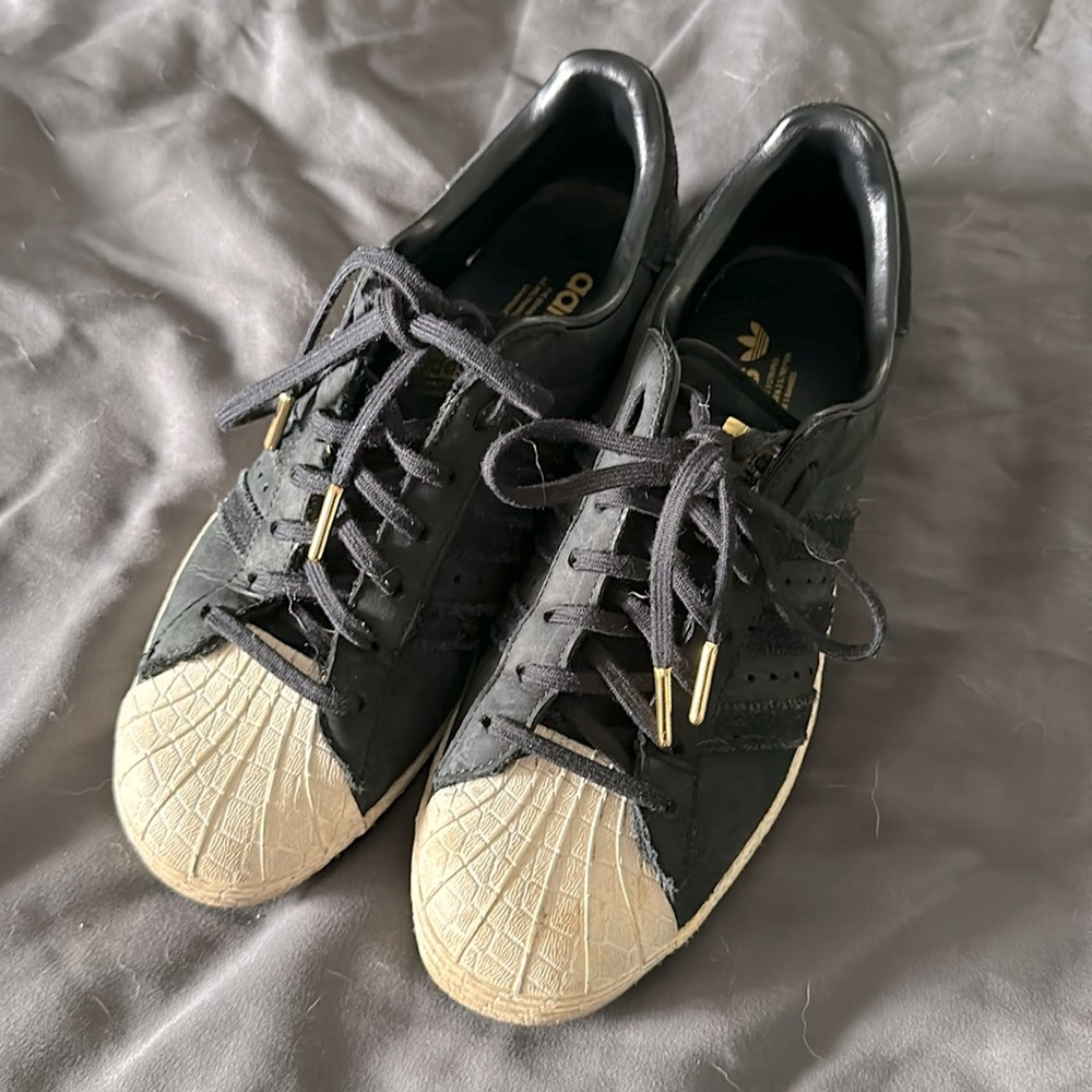 Adidas suede with gold accents and snakeskin toes! Very Cool!